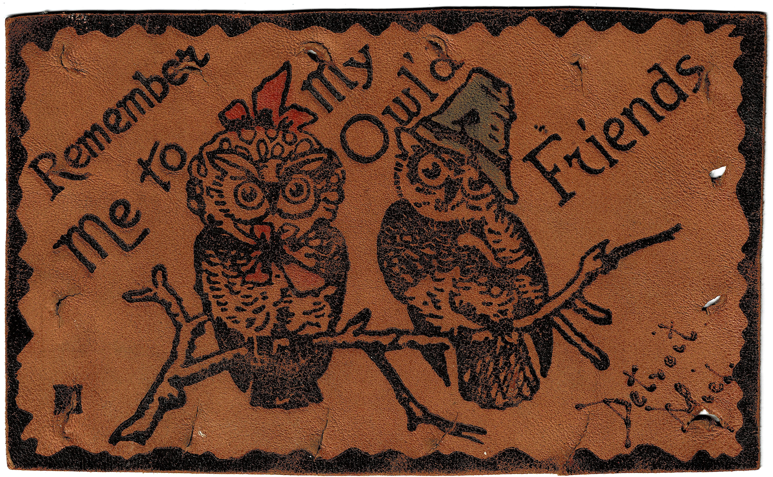 A leather postcard with two owls on it, one wearing a bonnet and the other wearing a slightly-conical hat. The message is: Remember me to my owl'd friends.